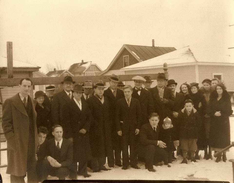 Group picture in Armfield's backyard for the visit of Dr. Shapley. Walter Scott Houston is posing with the child.