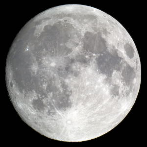 A full moon from the city by Christopher Strandt 